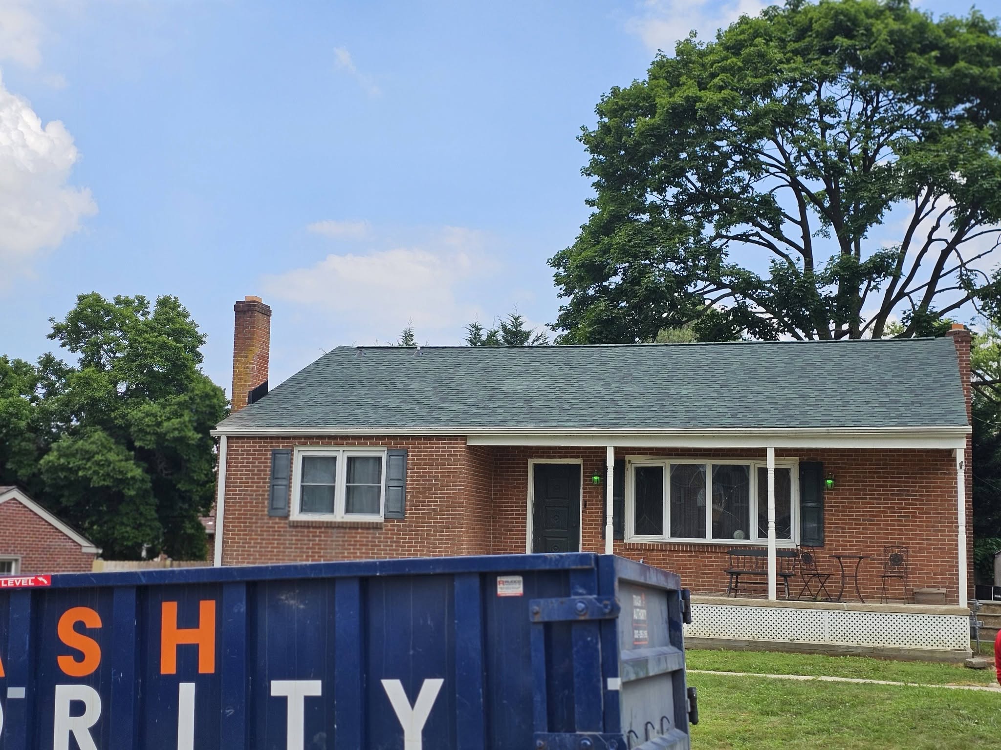 Jobsite setup outside a home before roof replacement